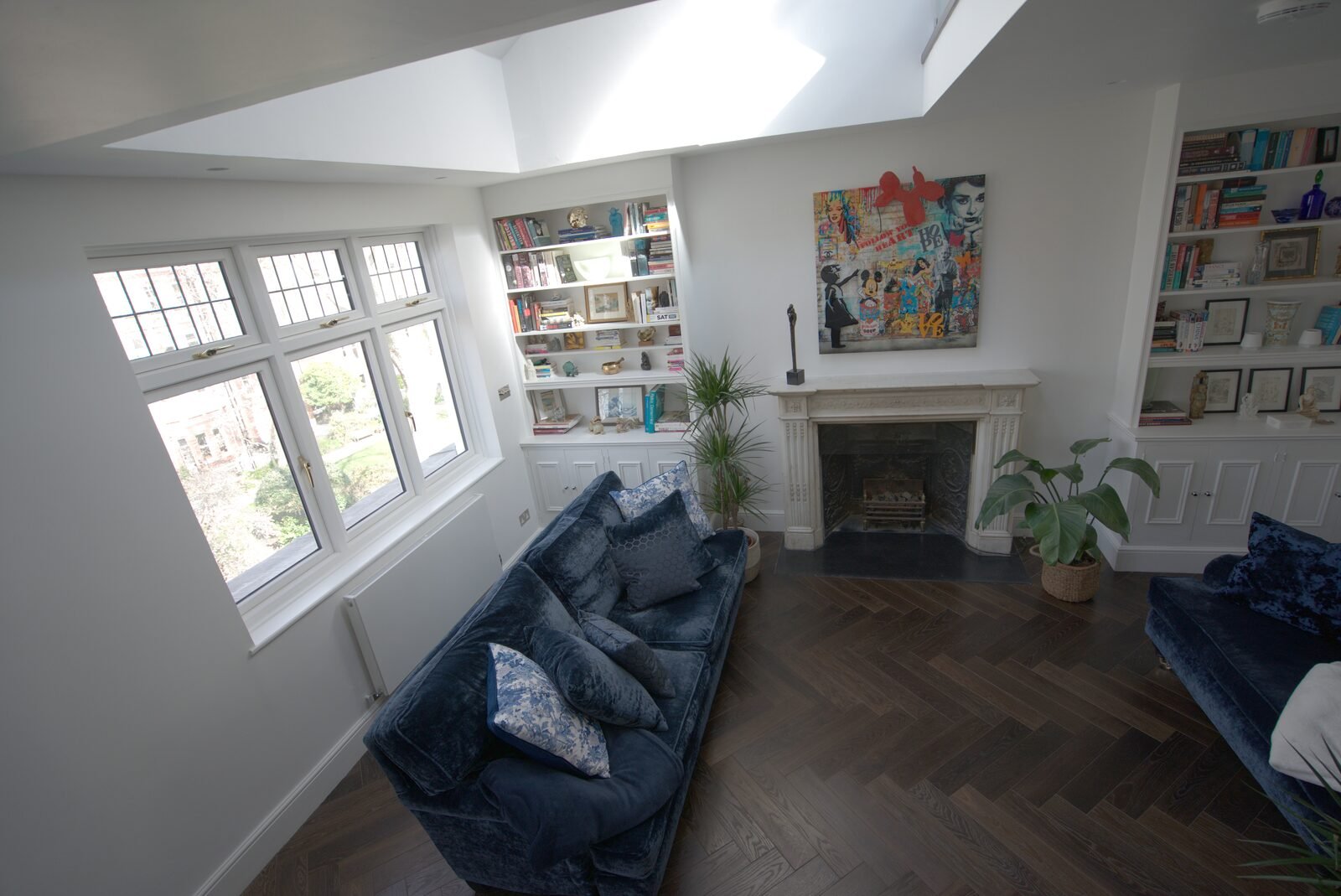 Leaded bay window with fitted bookshelves and fireplace, Earls Court