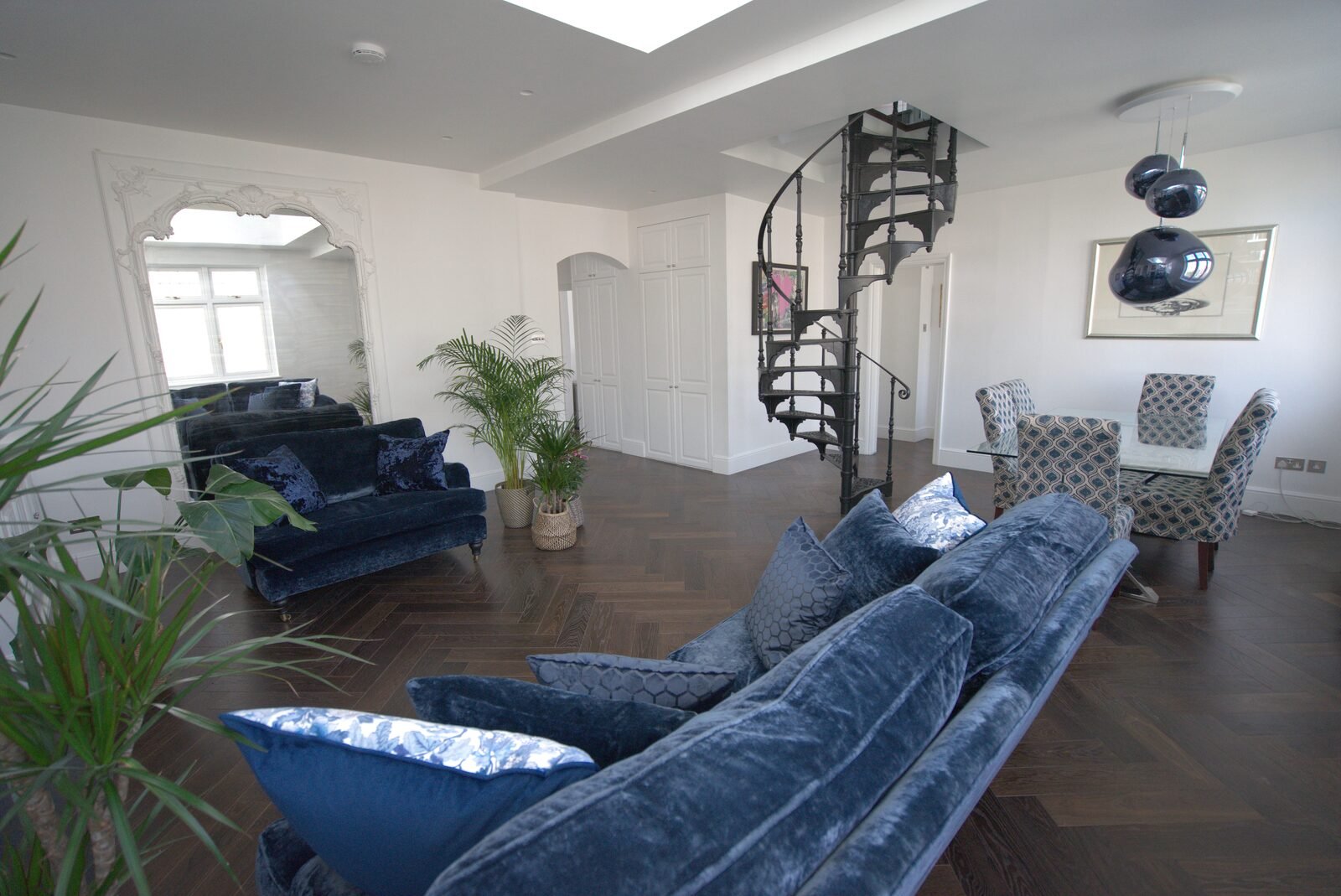 Open living space with parquet flooring and staircase, Earls Court